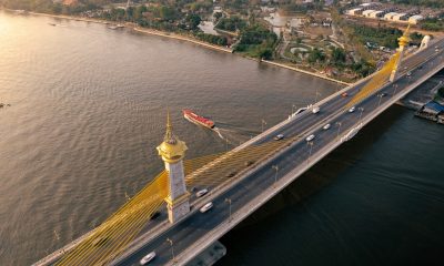 an aerial view of a bridge over a body of water