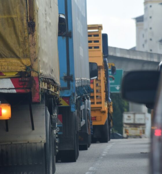 a couple of trucks that are sitting in the street