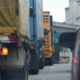 a couple of trucks that are sitting in the street