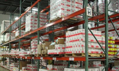 white and red cardboard boxes on shelf