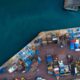 aerial photography of dock containers near body of water during daytime