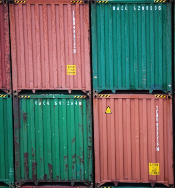 a stack of green and red containers sitting on top of each other