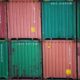 a stack of green and red containers sitting on top of each other