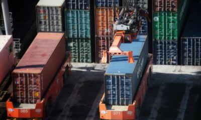 cargo containers are stacked on top of each other