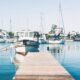 white motorboat near dock