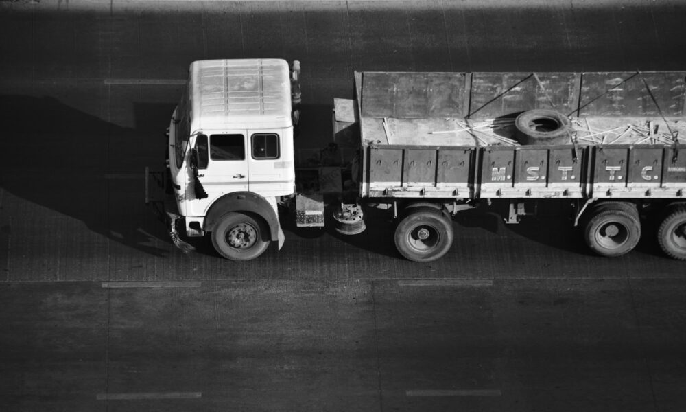 a black and white photo of a truck