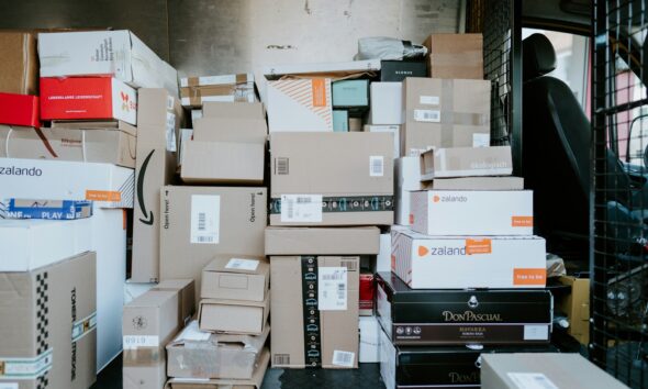 brown cardboard boxes on black plastic crate